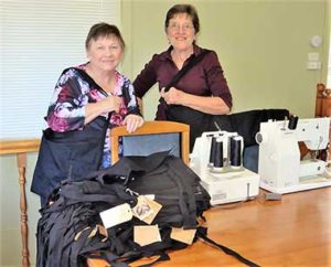 Turning aprons into bags.